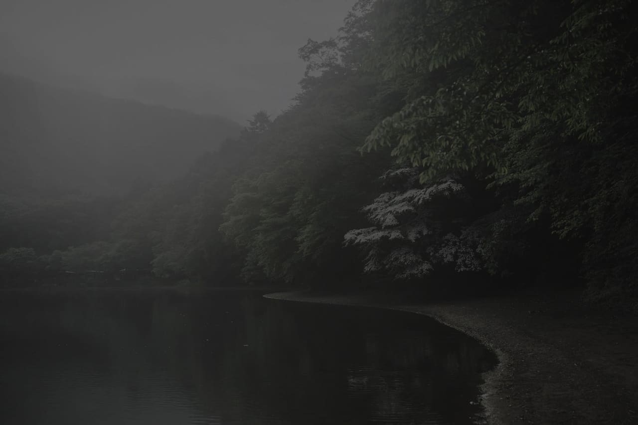 A shoreline under heavy cloud